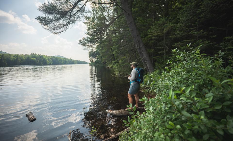 A hiker by Cascade Lake