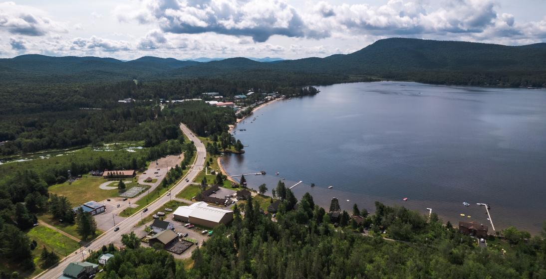 A giant lake sits along a small town. 