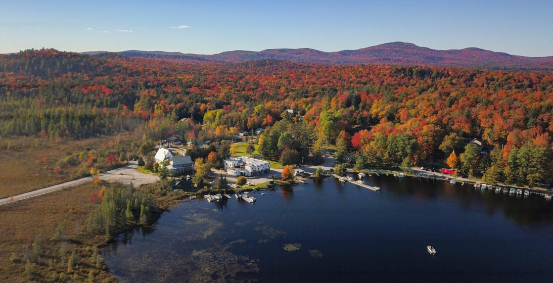 An aerial view of mountains and valley in fall. 