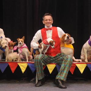 A photo of Jonny with his troupe of mutts