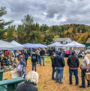 Many people and vendor pop ups at Hoss's Campground for the Octo-Bear-Fest