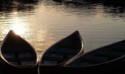 Canoes float peacefully on the lake