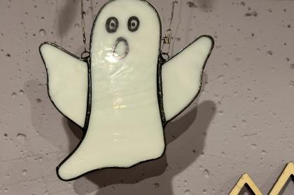 A stained glass ghost ornament