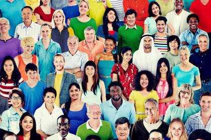 A photo of many people of different races