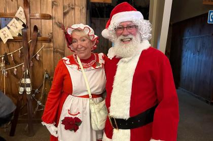 A couple dressed up as Mr & Mrs Clause