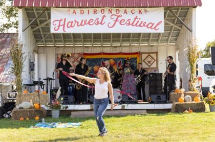 Woman dances to music at the Adirondack Harvest Festival