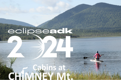 poster for event picturing a kayaker with mountains in the background what you see from the cabins at Chimney Mountain