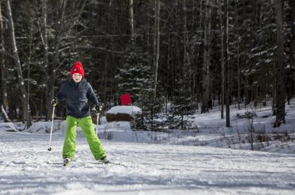 A boy with a red winter hat