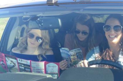 Three young women in a car