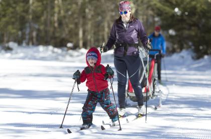 a family cross country skiing