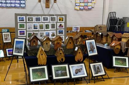 Booth of hand made bird houses and nature photography