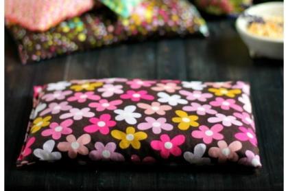 A photo of a hand made heating pad made of floral fabric
