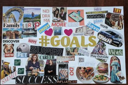 A vision board made with magazine cut outs of pictures and words/ phrases to describe their goals for the year