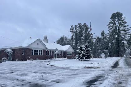 A photo of the church building in winter time with snow all around