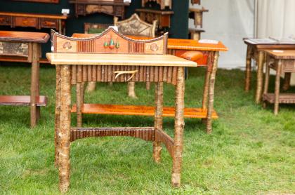 Several different end tables made from wood