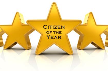 An image of a row of stars with the middle one reading Citizen of the Year on it