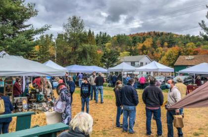 Many people and vendor pop ups at Hoss's Campground for the Octo-Bear-Fest