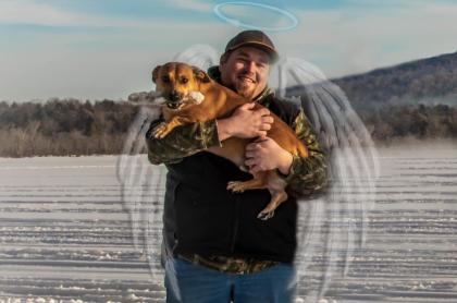 A photo of Joey holding a dog with images of angel wings and a halo over his head