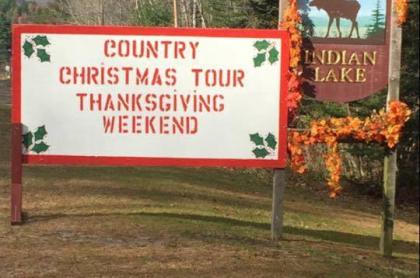 The sign at the entrance of town that reads- Country Christmaas Tour Thanksgiving Weekend