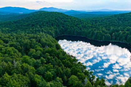 Clouds reflect in an Adirondack Pond
