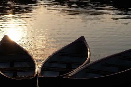 Canoes float peacefully on the lake