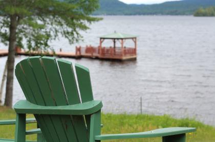 A gazebo floating on a dock in the water.