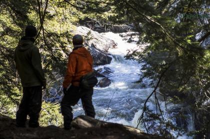 A couple looks out at Auger Flats Falls