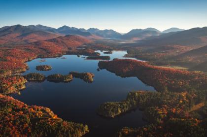 Aerial fall view of a complex of ponds among mountains