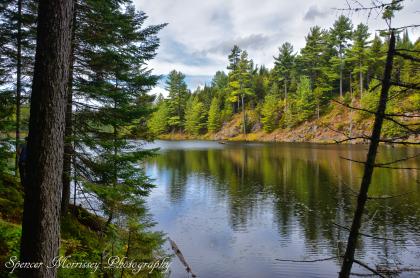 Narrows and cliffs add to the paddling interest of Lost Ponds.