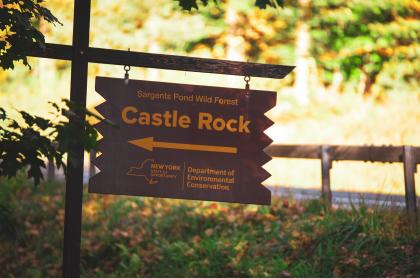 A wooden sign for Castle Rock