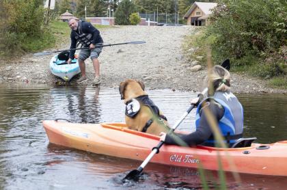 A couple kayakers by a hand launch