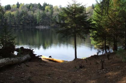 The tranquil waters of Little Tupper Lake beckon the paddler