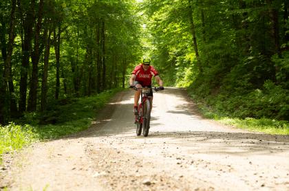 A cyclist on a dirt road