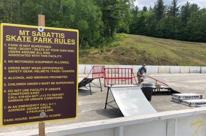 A sign for a skate park