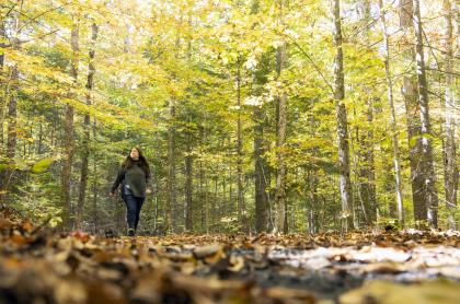 A woman walks on the trail at the AIC.
