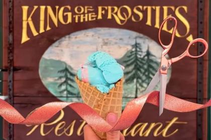 An ice cream cone and a ribbon in front of the entry sign to celebrate their grand opening!