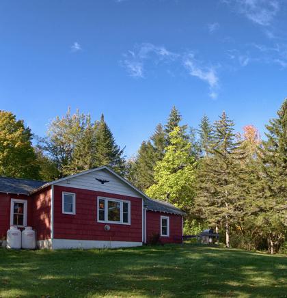 A red house with white trim.