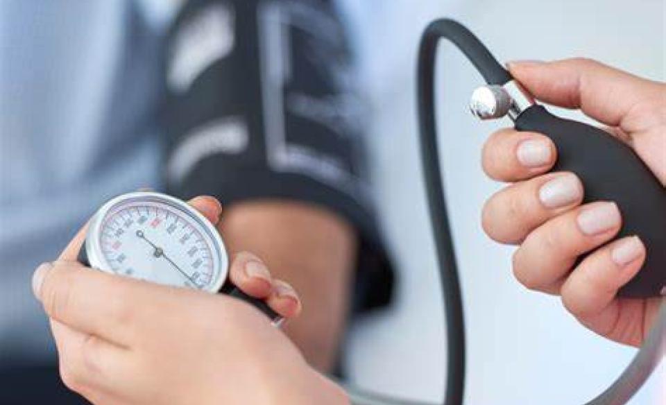 A photo pf a person getting their blood pressure reading