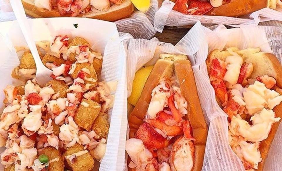 several different food items from the lobster truck like lobster and tots and a lobster roll