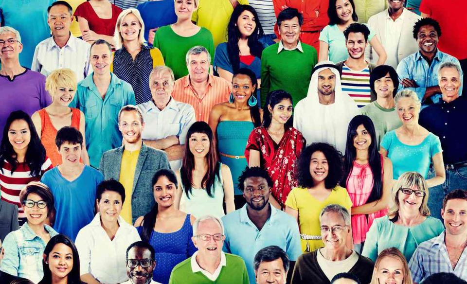 A photo of many people of different races
