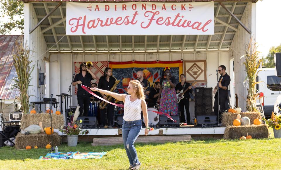 Woman dances to music at the Adirondack Harvest Festival