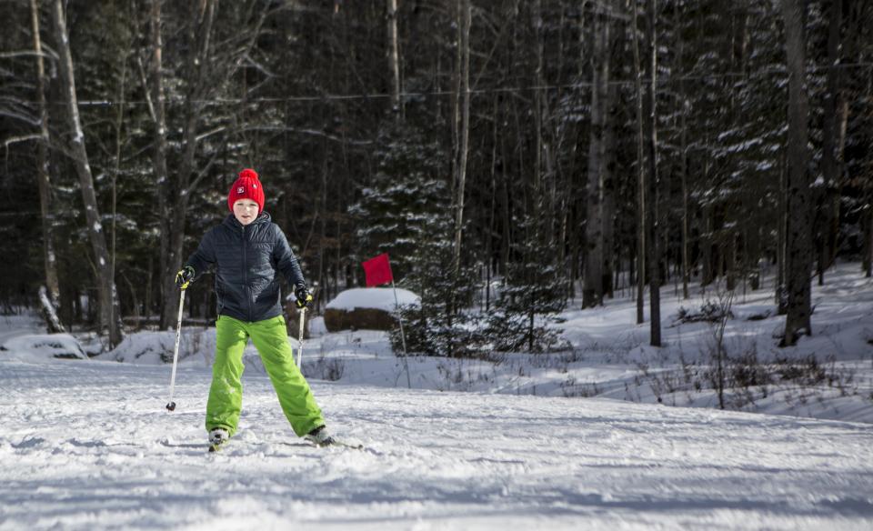 A boy with a red winter hat
