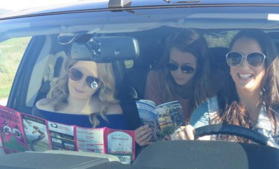 Three young women in a car