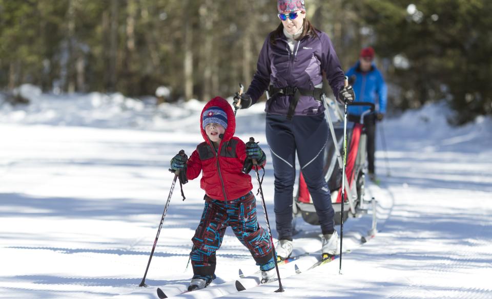 a family cross country skiing
