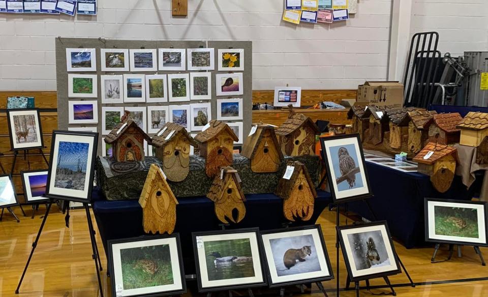 Booth of hand made bird houses and nature photography