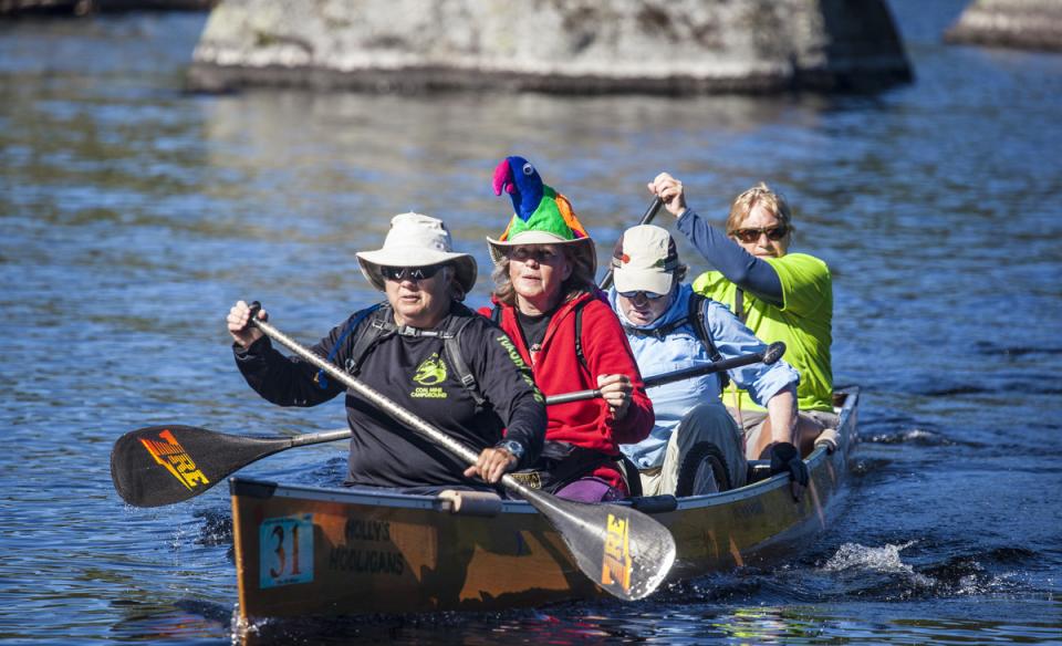 group of four paddlers in a boat