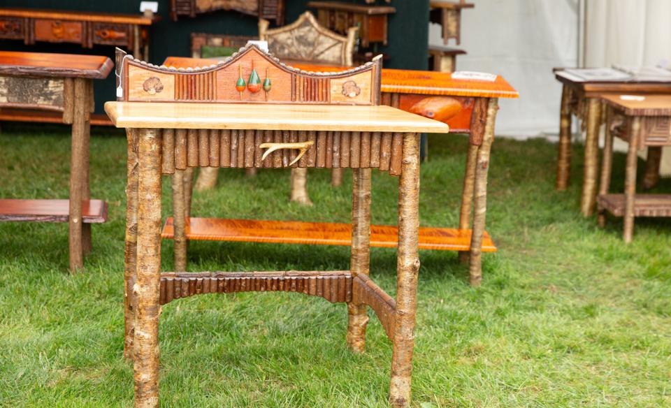Several different end tables made from wood