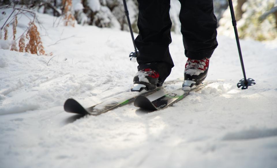 a close up photo of a x-country skiier's feet