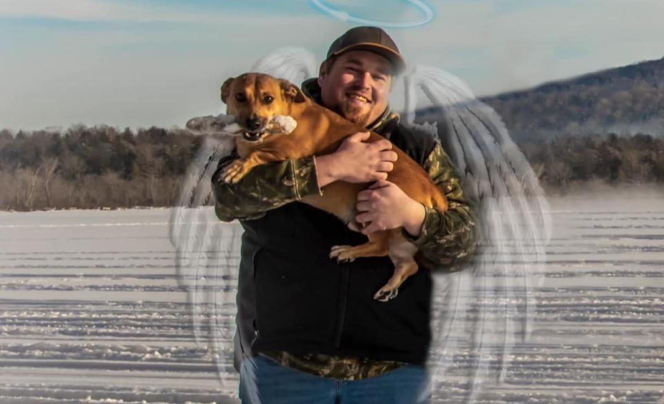 A photo of Joey holding a dog with images of angel wings and a halo over his head