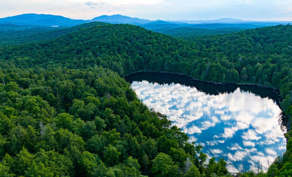 Clouds reflect in an Adirondack Pond